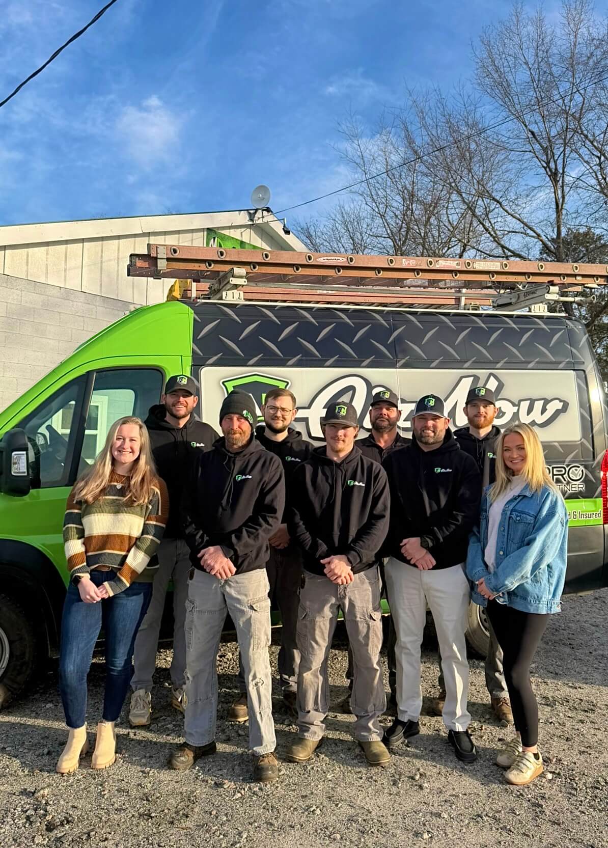 The AirNow team posing in front of one of their branded trucks in Sandersville